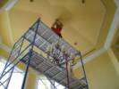 High Ceiling Custom Electric | Chandelier on Scaffolding with Electrician working on ceiling