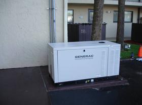 Generator Installation. GENERAC generator installed outside of building.